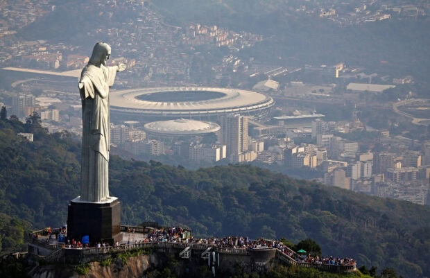 The Corcovado Mountain statue overlooking the city and stadium in Rio de Janeiro Brazil