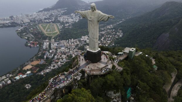 The Corcovado Mountain with the Christ the Redeemer statue overlooking Rio de Janeiro cityscape