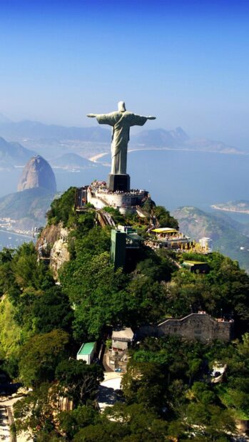 The Corcovado Mountain overlooking the city and ocean with the famous statue on top