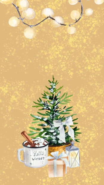 A cozy winter scene with a hot drink and small decorated pine tree in a warm setting