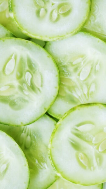 Close up of fresh cucumber slices showing natural texture and seeds