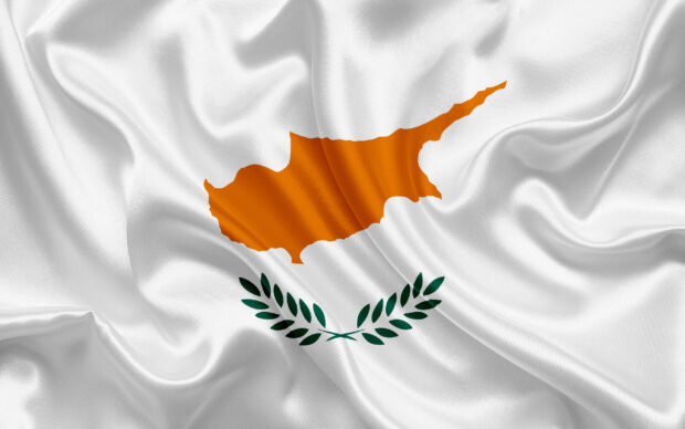Waving flag with Cyprus map and olive branches on white cloth texture