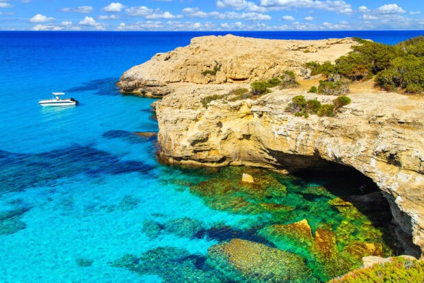 Clear waters and rocky cliffs in Cyprus coast with vibrant natural colors