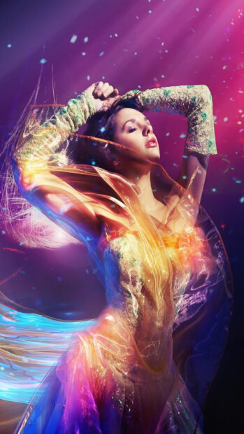 A dancer in a colorful flowing dress expresses emotion with graceful movement and closed eyes