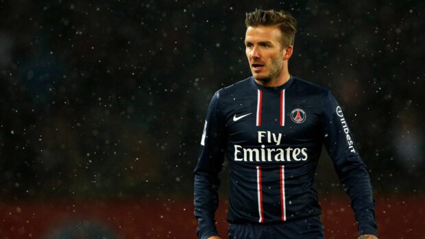 David Beckham in a Paris Saint Germain jersey on the football field during a night match