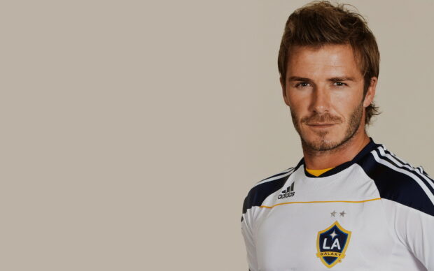 David Beckham wearing LA Galaxy jersey looking confidently at the camera