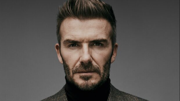 Close up portrait of David Beckham with intense gaze and beard