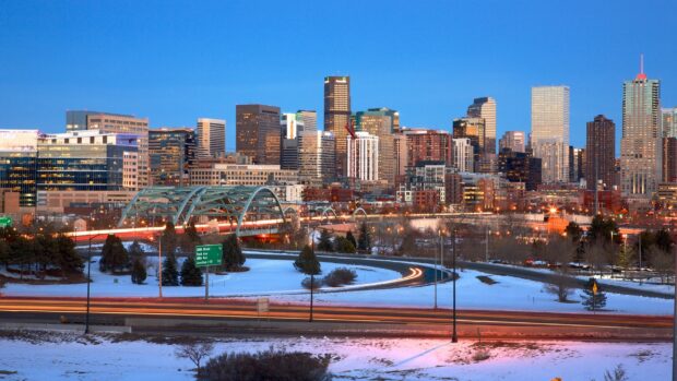 Denver Colorado Wallpapers 2K Desktop Denver cityscape with snow covered ground and glowing city lights at dusk in Colorado