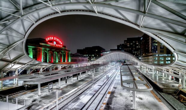 Denver Colorado Wallpapers 2K Desktop Union Station in Denver Colorado at night with illuminated train tracks and modern architecture