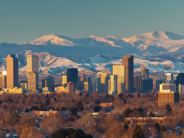 Denver Colorado Wallpapers HD Desktop Denver city skyline with snow covered Rocky Mountains in the background during sunset
