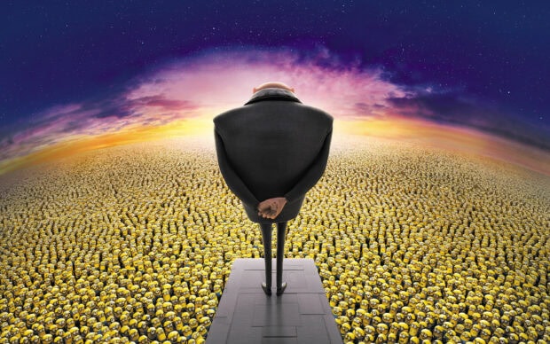 Gru standing in front of a large crowd of minions at sunset in Despicable Me