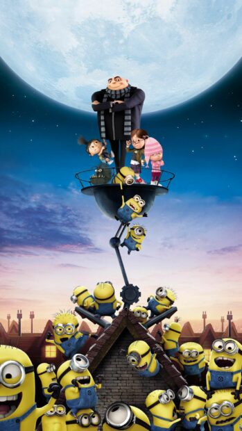Gru and children with minions having fun under the full moon at sunset