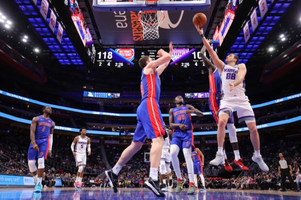 Detroit Pistons players in action during a basketball game against the Sacramento Kings