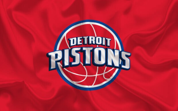 A detailed red fabric featuring the Detroit Pistons logo on a basketball design