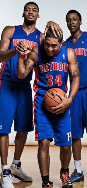Detroit Pistons players celebrating a basketball moment in blue jerseys