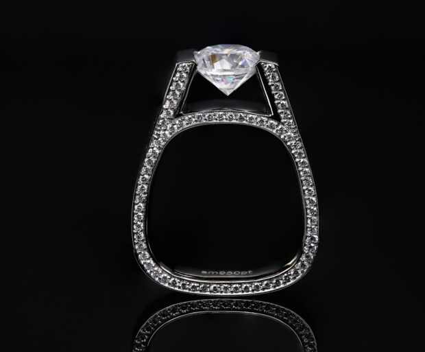 Diamond jewelry with large diamond centerpiece and small diamonds on silver ring