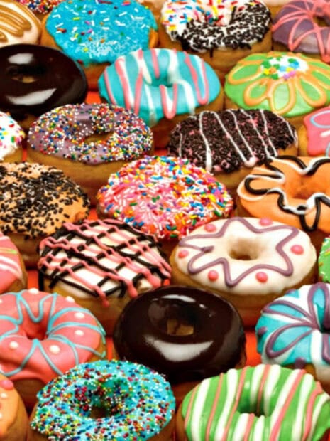 Colorful donut with various toppings and icing in a close up view