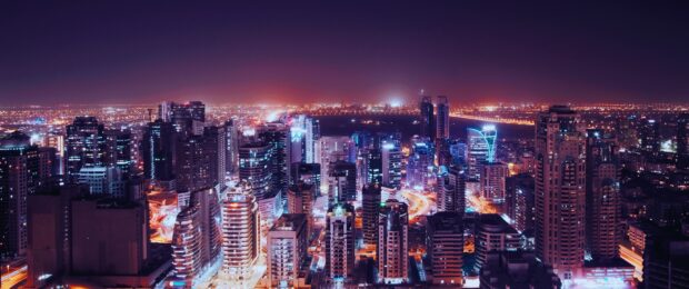 Dubai skyline view with illuminated skyscrapers and city lights at night