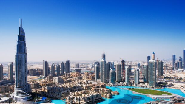 Dubai skyline featuring modern skyscrapers and urban landscape under a clear blue sky