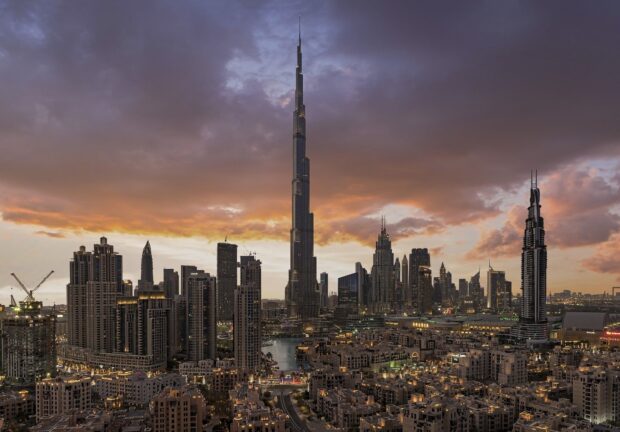 Dubai skyline with sunset and modern skyscrapers including Burj Khalifa in HD quality