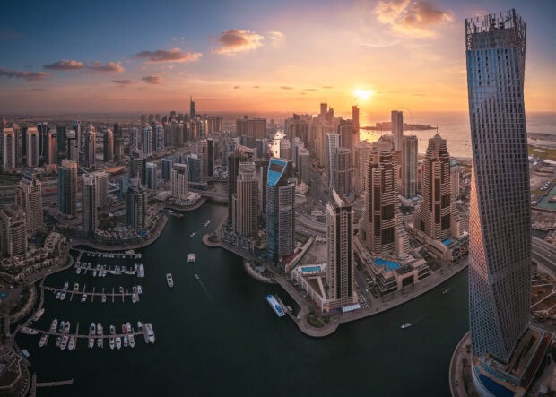 Stunning Dubai skyline with skyscrapers and waterfront at sunset showcasing the city's vibrant architecture