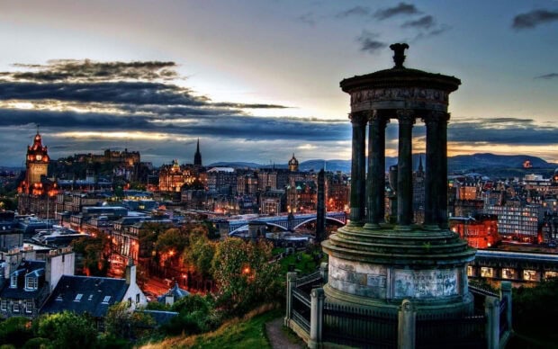 Edinburgh city skyline with iconic monument and historic buildings at dusk