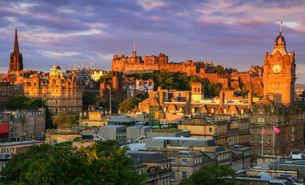 Edinburgh skyline featuring historic buildings and Edinburgh Castle at sunset