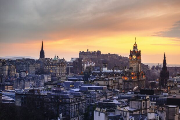 Edinburgh skyline with historic buildings and sunset sky in high definition