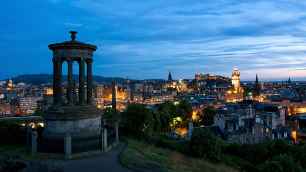 Edinburgh skyline with historic monuments and city lights at dusk