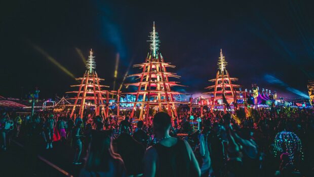 Festival structures illuminated at night during festival celebration