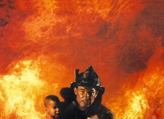 Fireman carrying a child out of a burning building during a rescue operation