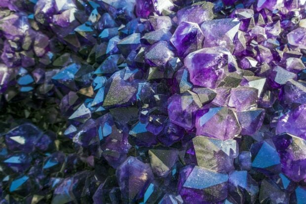 Close up view of vibrant gemstone crystals in various purple hues