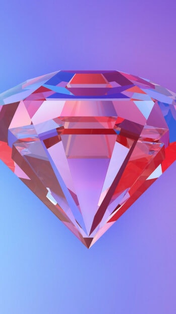 Close up view of a colorful gemstone with sharp facets and vibrant reflections