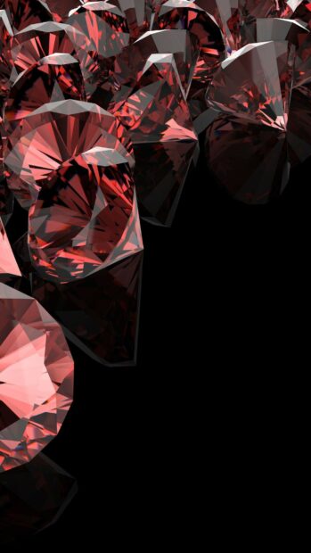 Shiny red gemstone cluster with detailed facets on black background