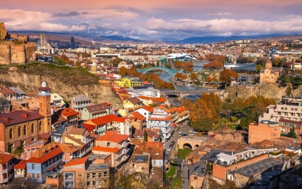 A panoramic view of Georgia cityscape with autumn colors and historic architecture