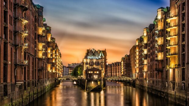 Historic architecture along a canal in Germany at sunset showcasing Germany