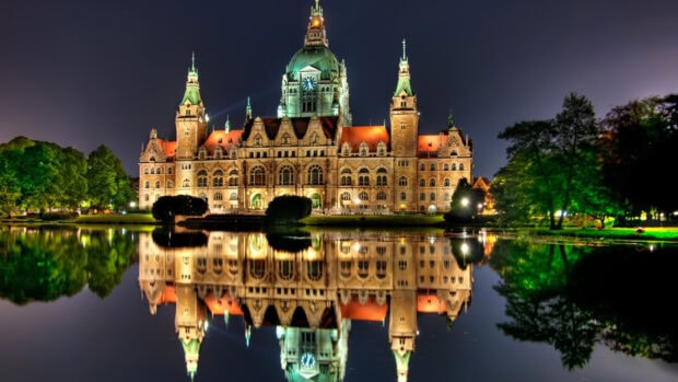 Historic Germany building reflected in calm water at night