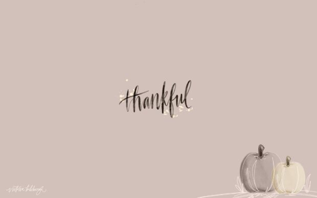 Thankful calligraphy with decorative pumpkins symbolizing gratitude and autumn vibes