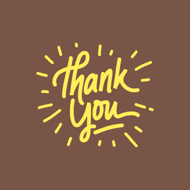 Yellow thank you handwritten lettering expressing gratitude on brown background