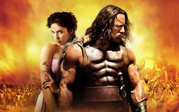 Hercules strong warrior standing with a woman behind him in an ancient battle scene