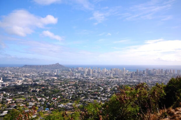 A panoramic view of Honolulu cityscape with Diamond Head mountain in the background