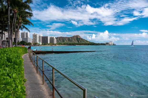 Scenic view of Honolulu coastline and Diamond Head mountain with clear blue sky
