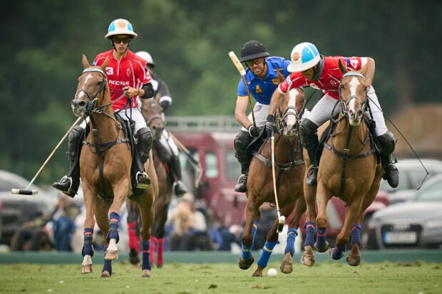Skilled horse polo players competing fiercely on the field in an exciting horse polo match