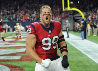Houston Texans player celebrating fiercely on the field in a red uniform