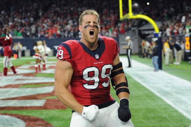 Houston Texans player celebrating fiercely on the field in a red uniform