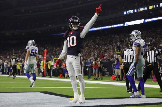 Houston Texans player number 10 celebrating a touchdown during a game against the Dallas Cowboys