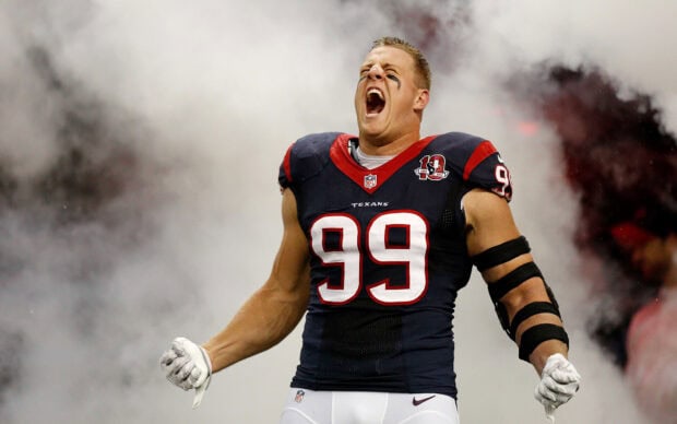 Houston Texans player celebrating fiercely during a game in full uniform