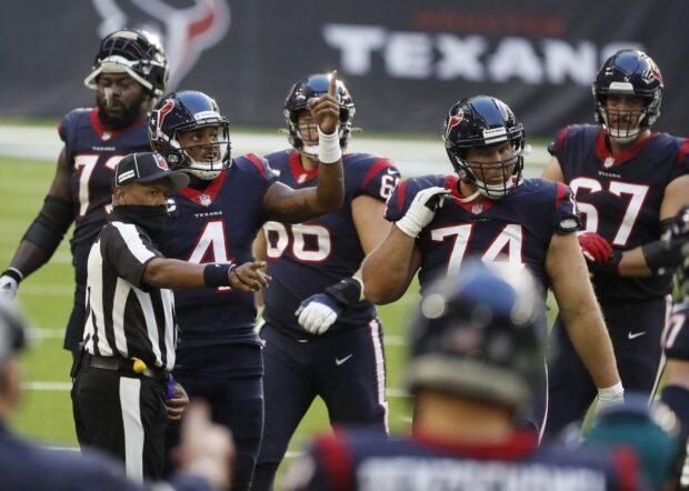 Houston Texans player number 4 discussing with referee during football game