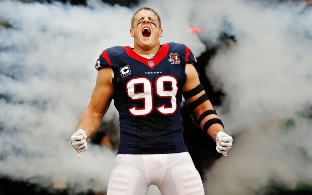 Houston Texans player number 99 showing excitement on the field in a football uniform