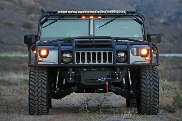 Front view of a rugged Hummer vehicle equipped for off road driving